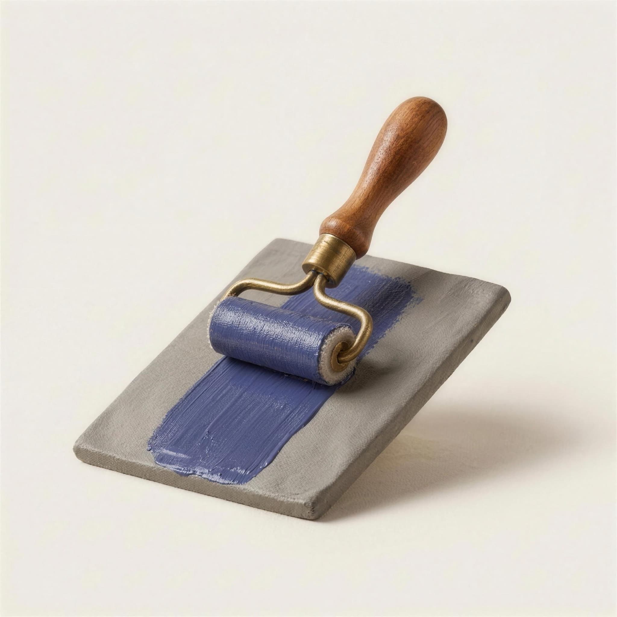 A paint roller laying down a fresh band of indigo