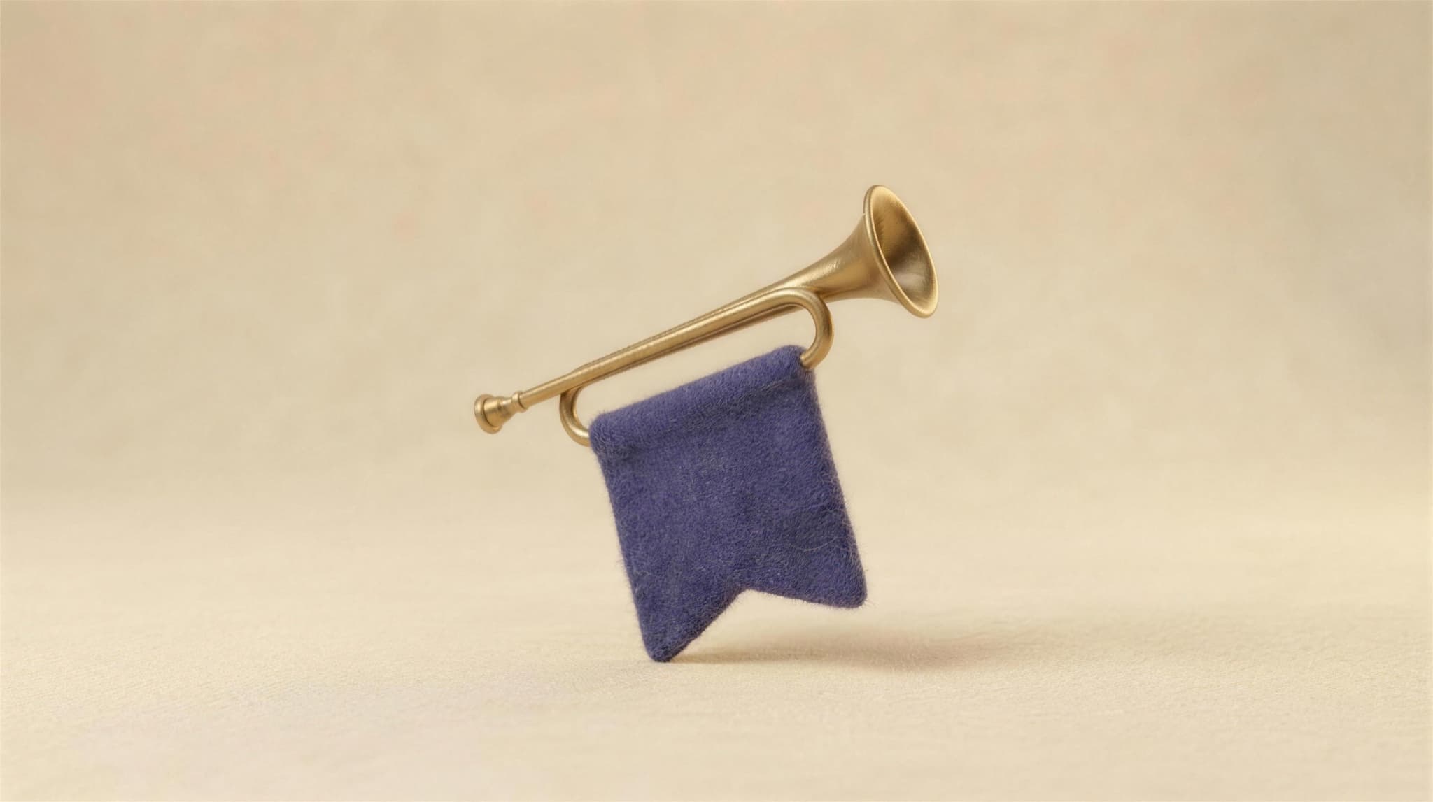 A brass herald trumpet with an indigo felt banner